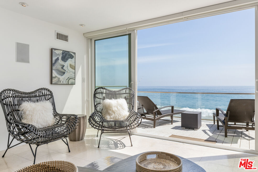 20520 Pacific Coast Highway Malibu, CA 90265 - Photo 3 of 27 a view of a livingroom with furniture and lounge chair