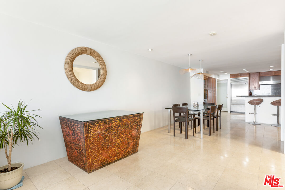 20520 Pacific Coast Highway Malibu, CA 90265 - Photo 8 of 27 a dining room with furniture and a potted plant