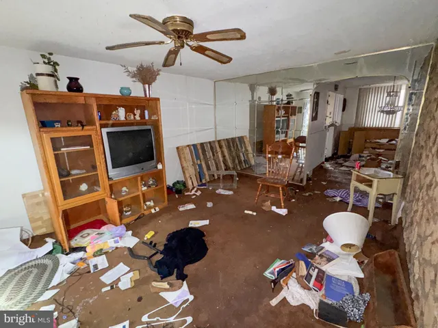 a room with furniture and a flat screen tv