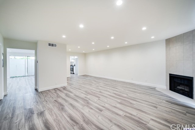 1050 Spazier Avenue, Unit 5 Glendale, CA 91201 - Photo 1 of 27 a view of empty room with wooden floor
