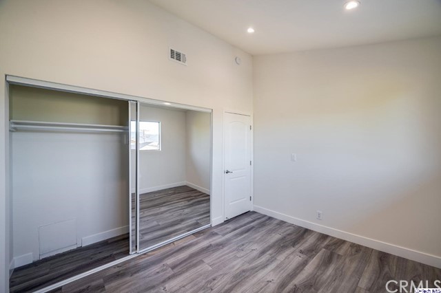 1050 Spazier Avenue, Unit 5 Glendale, CA 91201 - Photo 21 of 27 a view of an empty room with wooden floor