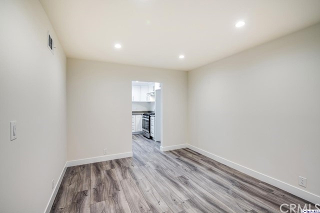 1050 Spazier Avenue, Unit 5 Glendale, CA 91201 - Photo 5 of 27 a view of room with wooden floor