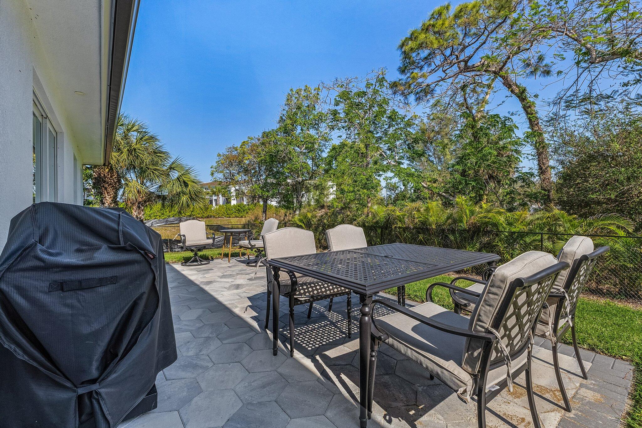 2499 Pine Street Naples, FL 34112 - Photo 16 of 18 a view of a backyard with sitting area