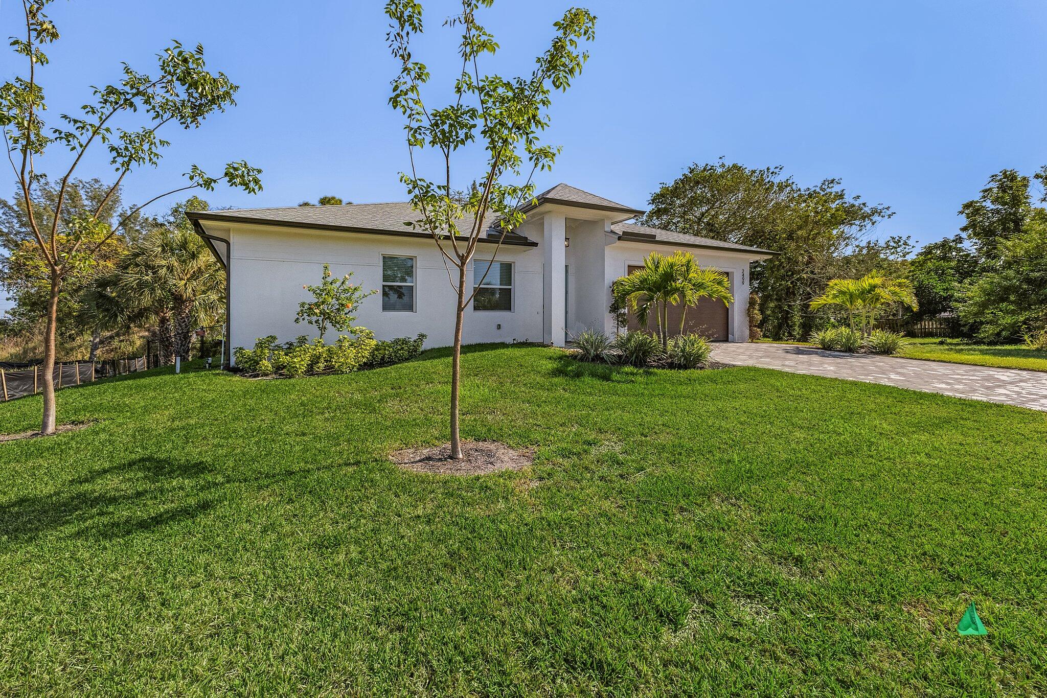 2499 Pine Street Naples, FL 34112 - Photo 18 of 18 a front view of house with yard and green space