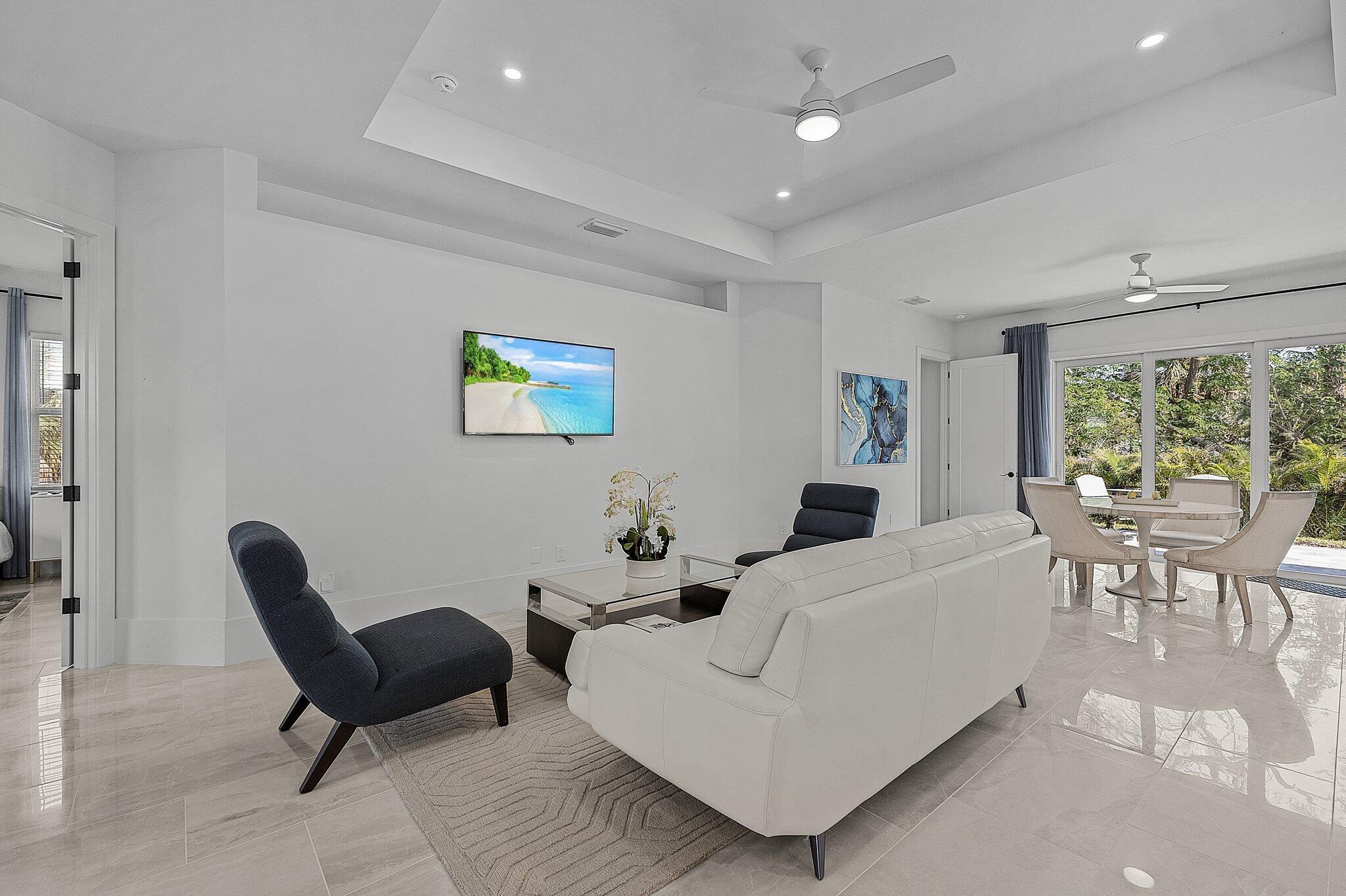 2499 Pine Street Naples, FL 34112 - Photo 2 of 18 a living room with furniture and a large window