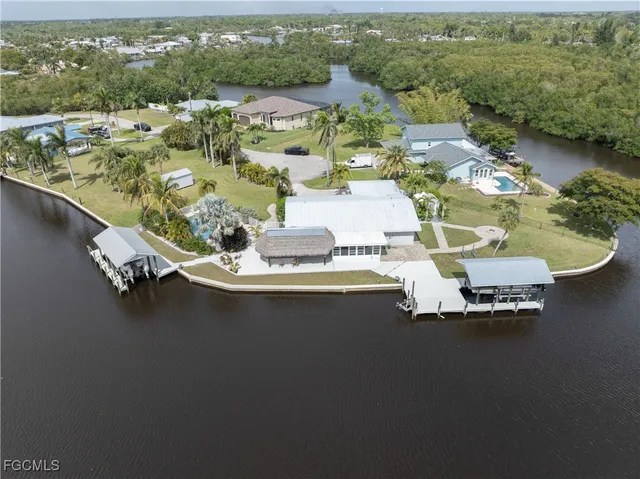 an aerial view of a house with a ocean view