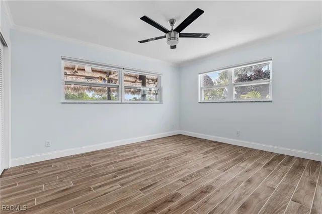a view of room with wooden floor and window