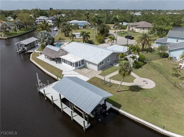 an aerial view of a house with a ocean view