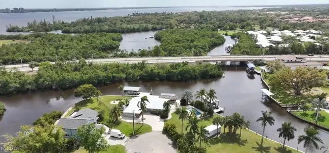 an aerial view of a house with a lake view
