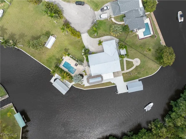 an aerial view of a house with a swimming pool