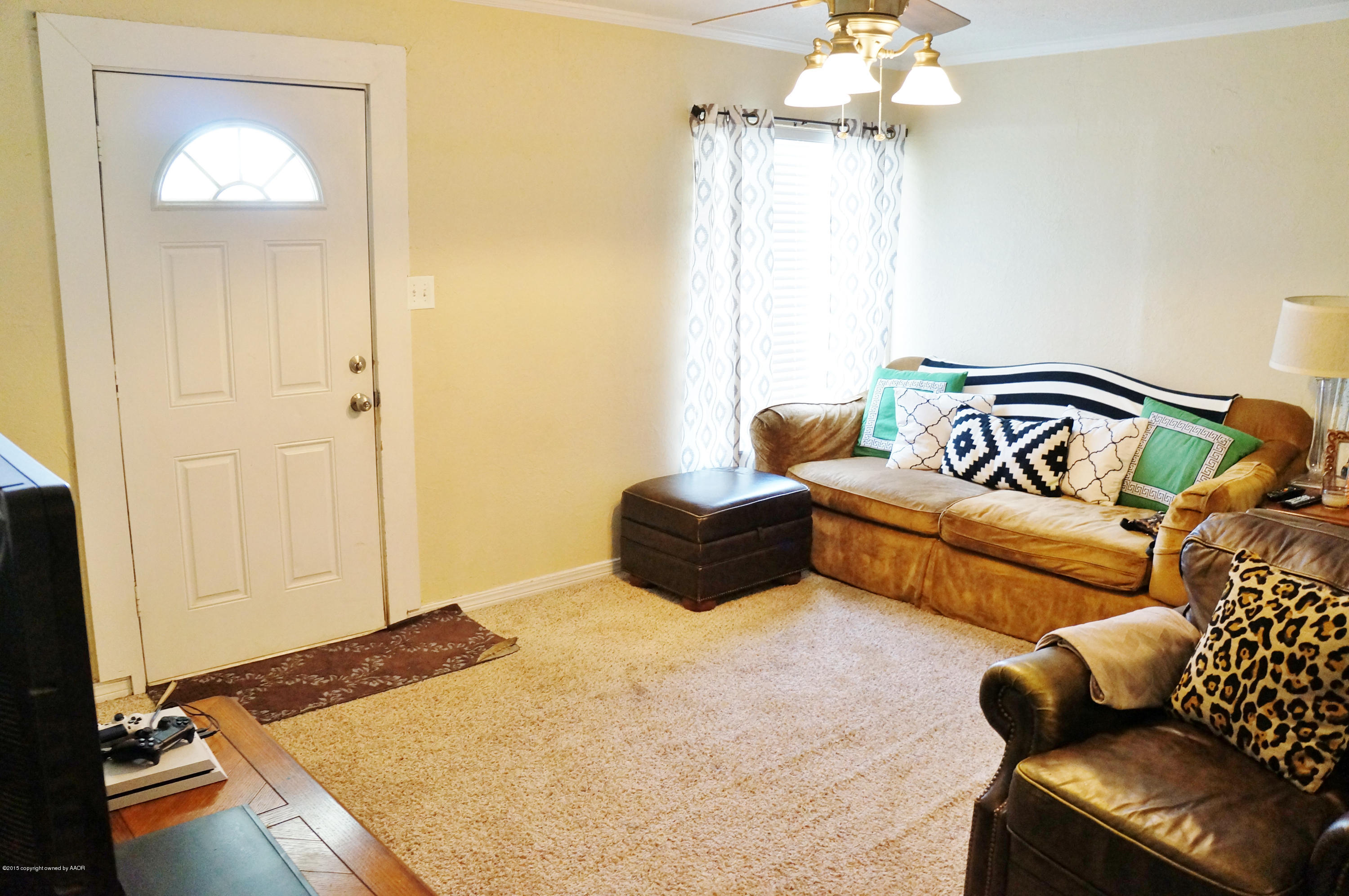 4207 Bowie Street Amarillo, TX 79110 - Photo 3 of 11 a bedroom with a bed and couch