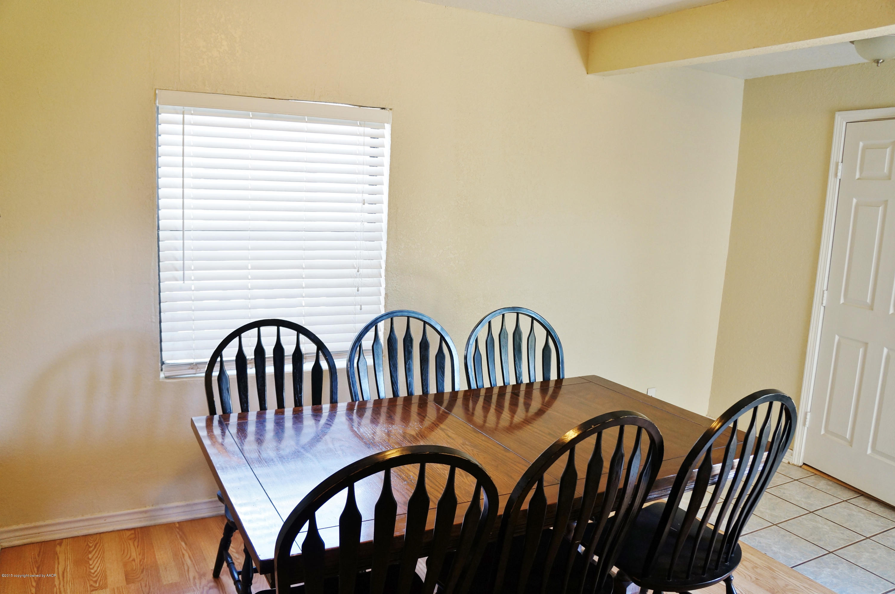 4207 Bowie Street Amarillo, TX 79110 - Photo 5 of 11 a view of a wooden table and chairs
