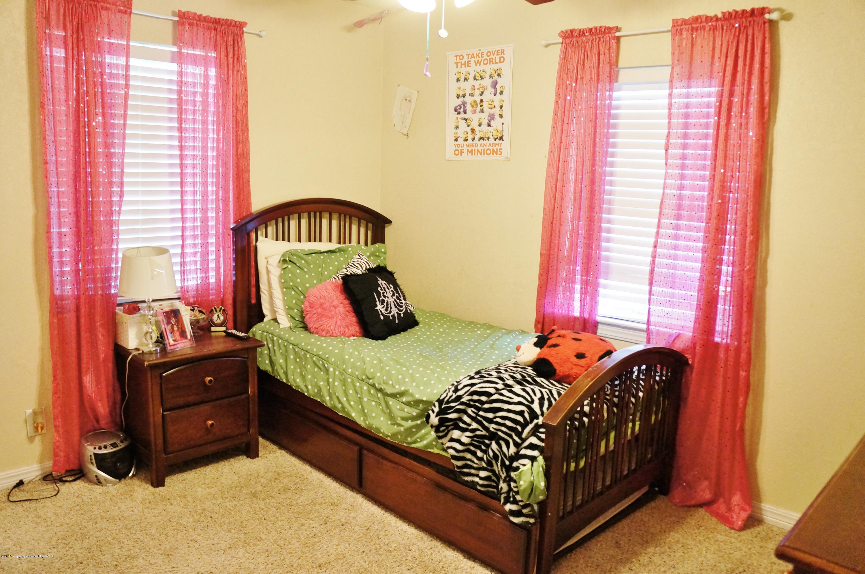 4207 Bowie Street Amarillo, TX 79110 - Photo 8 of 11 a bedroom with a bed and window