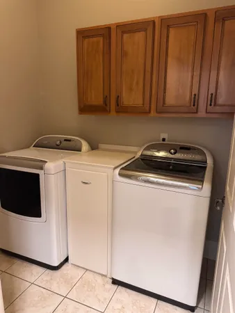 a utility room with washer and dryer