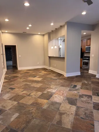 a view of an empty room with a fireplace