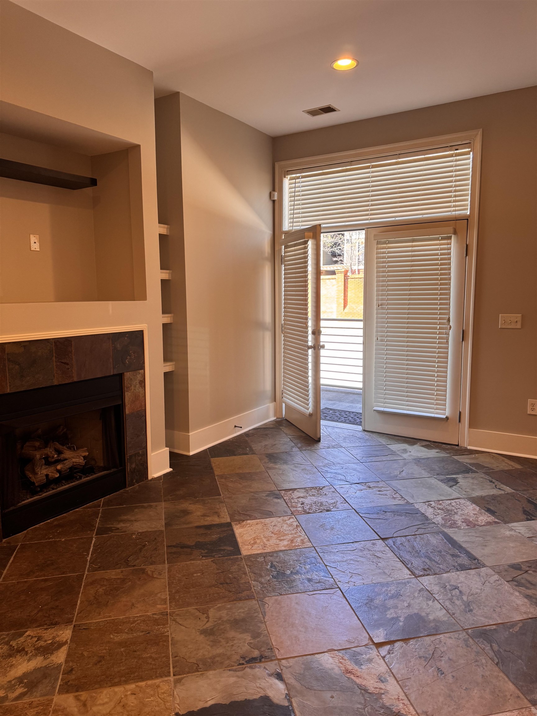 620 Tennessee Street Memphis, TN 38103 - Photo 5 of 34 a view of empty room with a fireplace and window