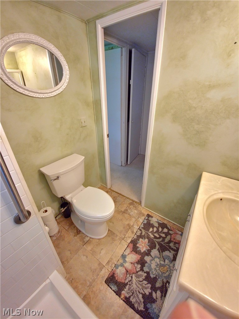 11076 Leader Road Chardon, OH 44024 - Photo 11 of 14 Bathroom with tile flooring, vanity, and toilet