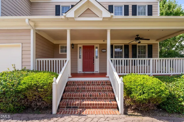 a bathroom with bathtub and window