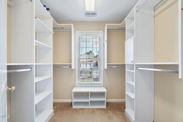 a view of a bedroom walk in closet and bedroom