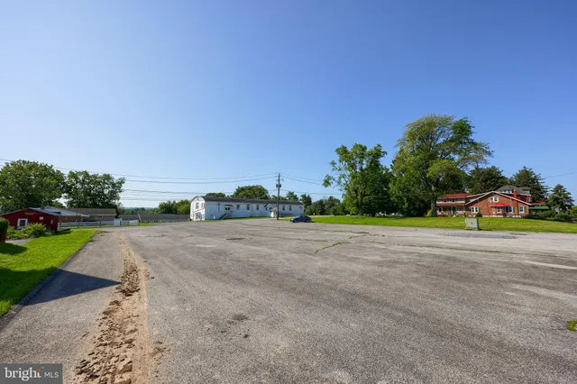 a view of a road with a building in the background