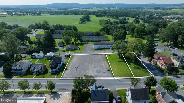 an aerial view of a house with a garden