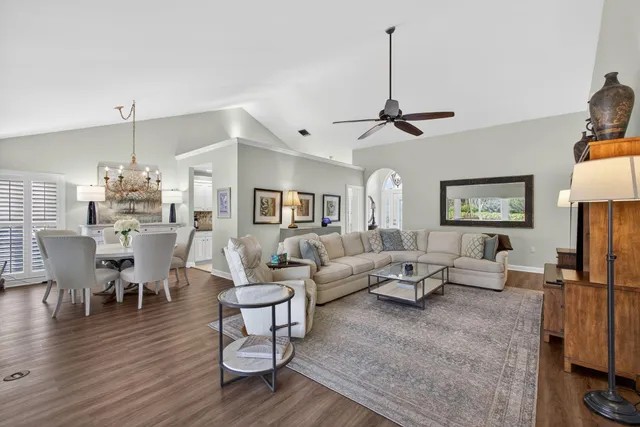 a view of a dining room with furniture wooden floor and chandelier