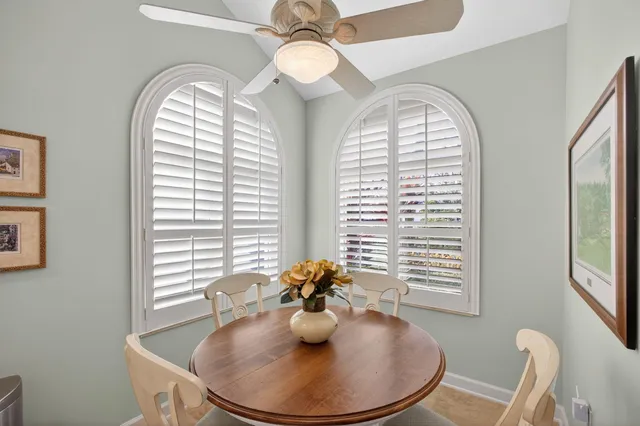 a bathroom with a shower a mirror and a sink