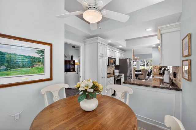 a bedroom with a bed and a potted plant