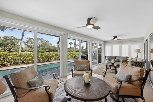 a spacious bathroom with a granite countertop sink and a mirror