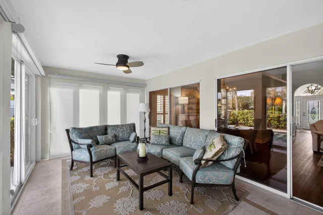 a bedroom with two beds and a chandelier
