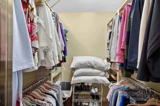 a view of a house with backyard sitting area and garden