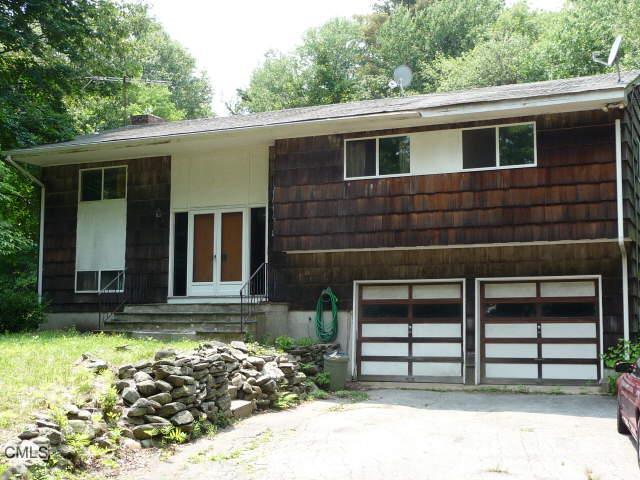 415 Barn Hill Road Monroe, CT 06468 - Photo 1 of 1 a front view of a house with a yard