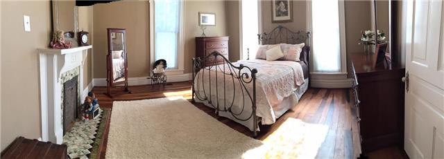 403 North Oak Street Springfield, TN 37172 - Photo 14 of 20 a bedroom with a bed and a mirror