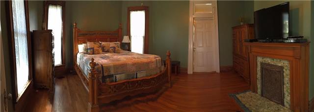 403 North Oak Street Springfield, TN 37172 - Photo 16 of 20 a bedroom with a bed tv and a mirror