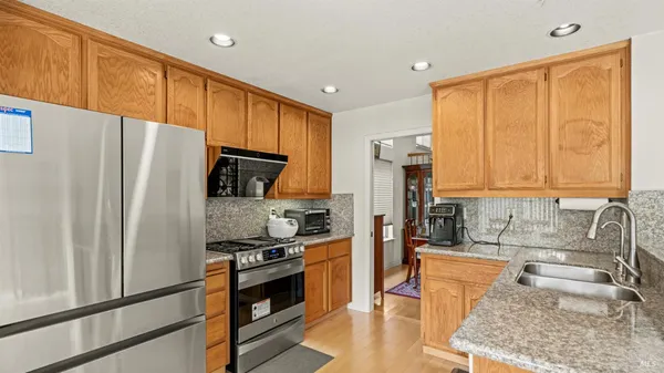 a kitchen with a stove and a microwave