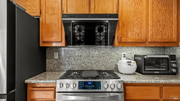 a view of a hallway with wooden floor and stairs
