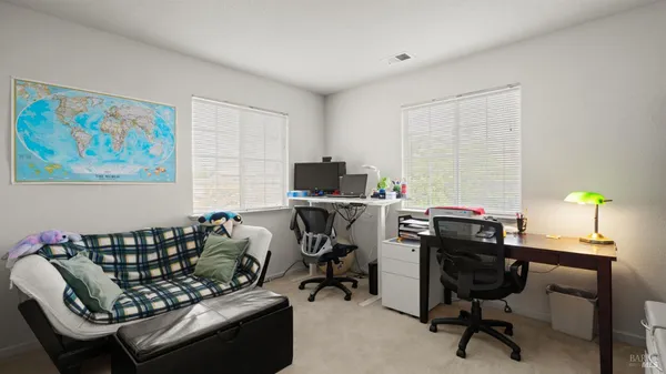 a bedroom with a bed and a cabinets