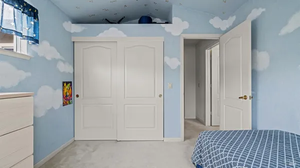 a bathroom with a tub a sink and mirror