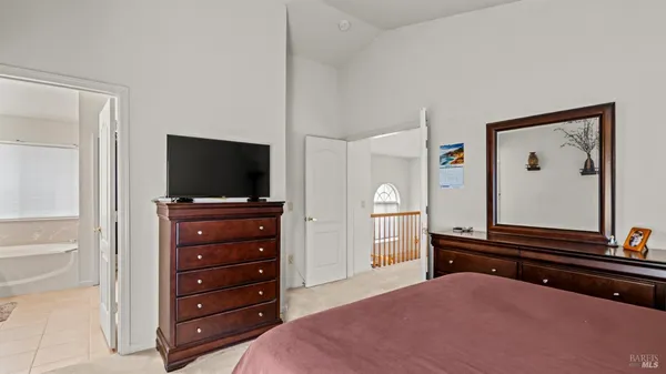 a view of a house with backyard and a tree