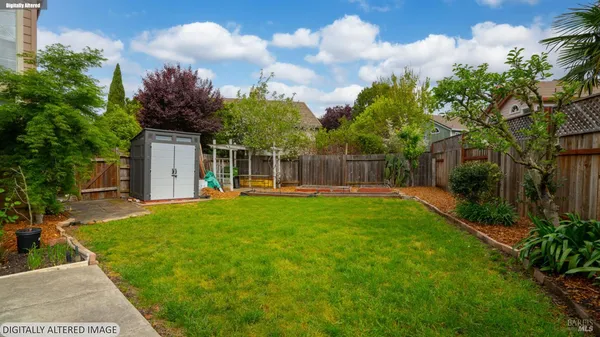 a view of a house with a small yard and plants