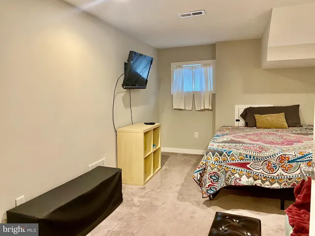 a bedroom with a bed and furniture