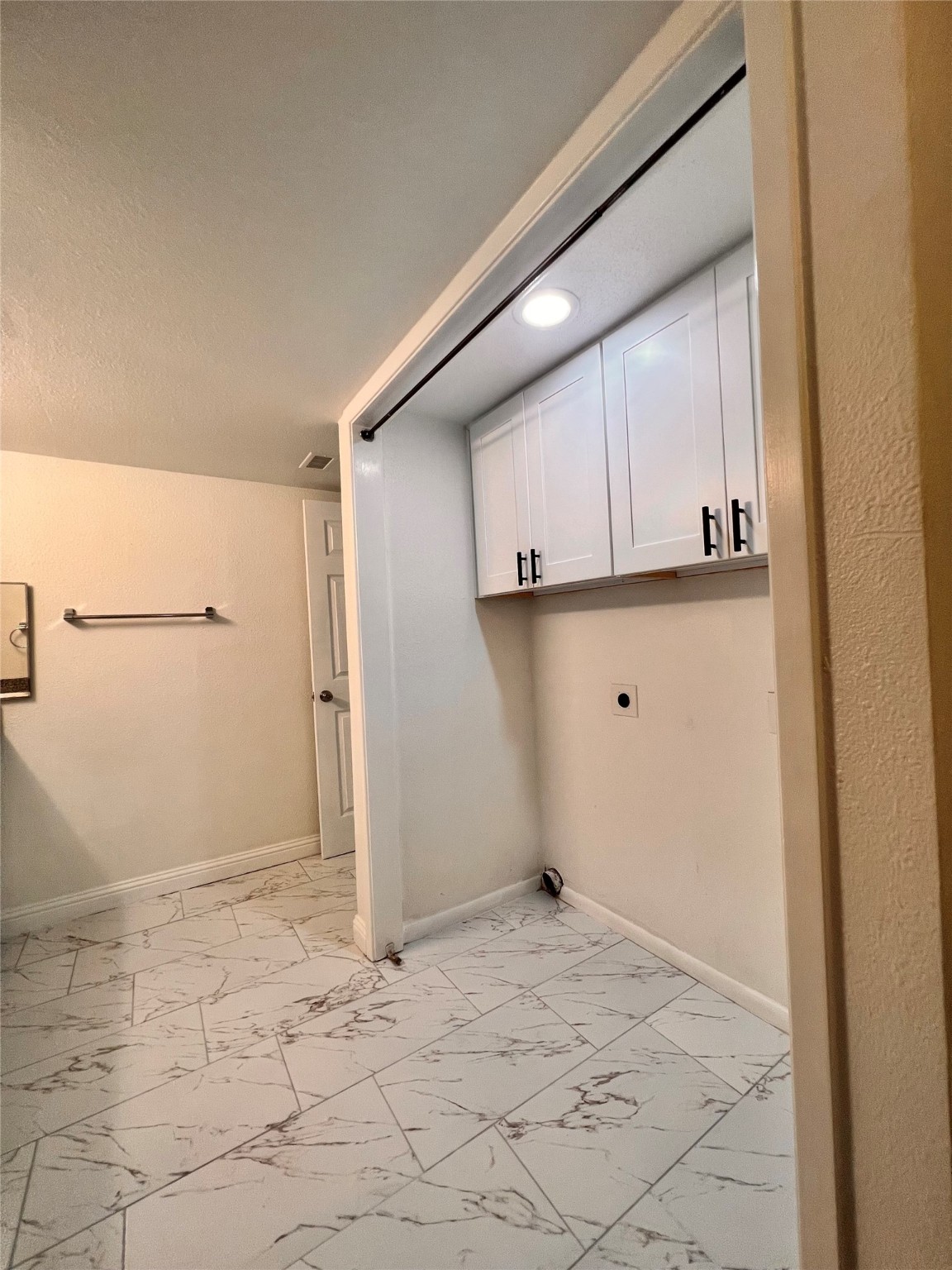 3005 Walnut Bend Lane, Unit 32 Houston, TX 77042 - Photo 19 of 26 a view of a kitchen with white cabinets and wooden floor