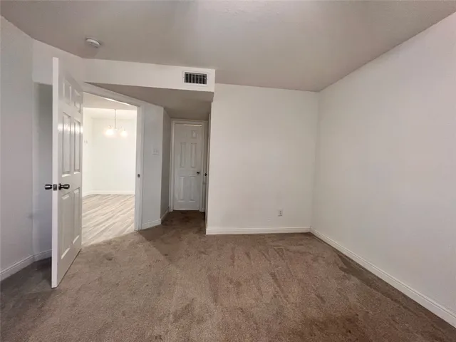 a bathroom with a granite countertop sink a toilet and bathtub