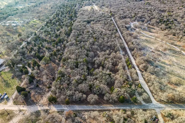 an aerial view of residential building and trees
