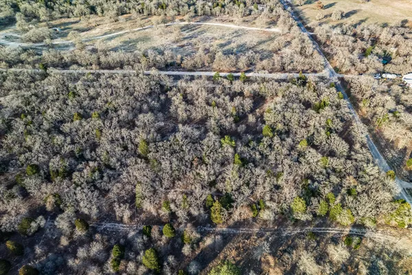 an aerial view of house with yard