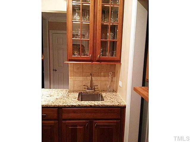 2504 Treen Street Raleigh, NC 27614 - Photo 13 of 13 Another view of the Butler's pantry with granite and bar.