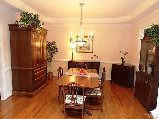 2504 Treen Street Raleigh, NC 27614 - Photo 3 of 13 Spacious dining room with hardwood floors and tray ceiling.