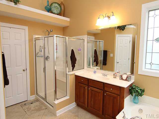 2504 Treen Street Raleigh, NC 27614 - Photo 8 of 13 Master bath offers split vanities, separate shower and oversized tub.