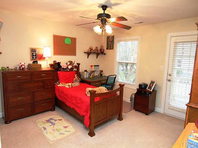 2504 Treen Street Raleigh, NC 27614 - Photo 10 of 13 Secondary bedroom with door to the second level porch