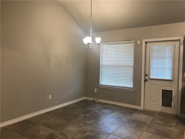 an empty room with a bathroom